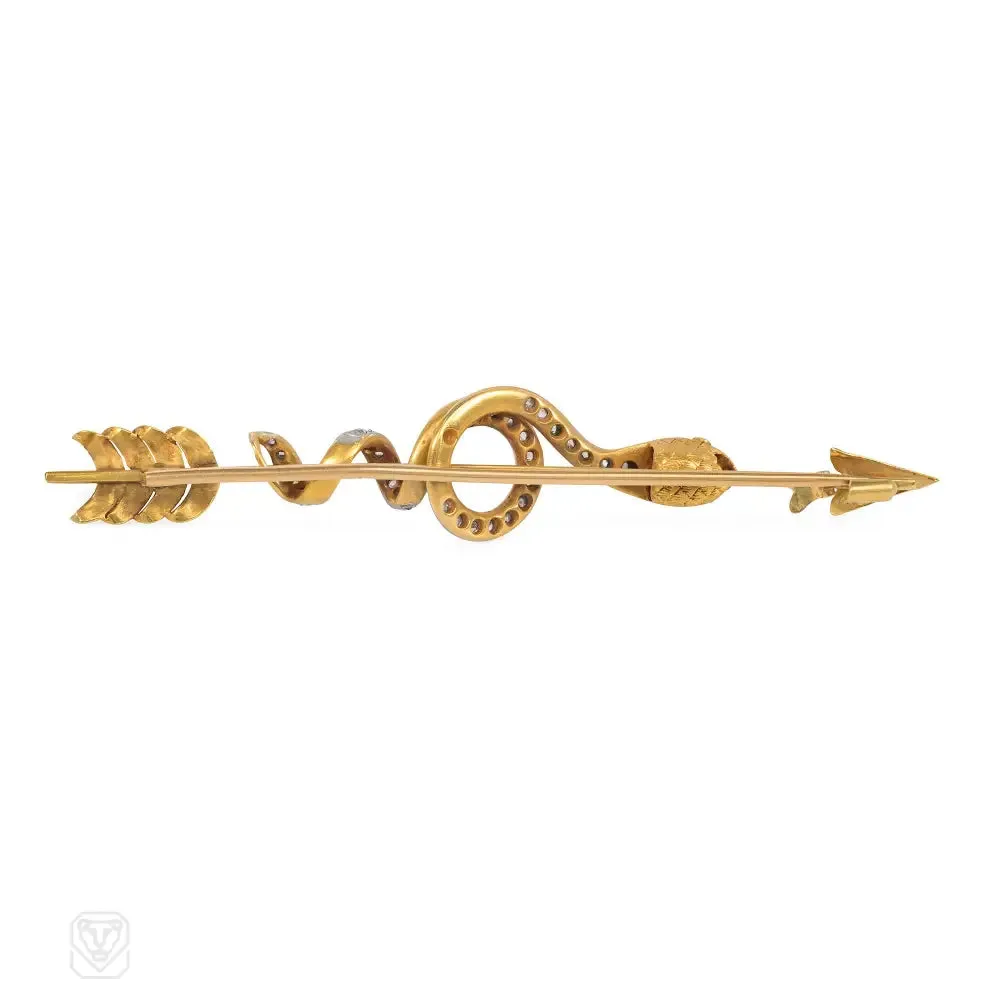 Antique gold, diamond, and emerald snake and arrow brooch